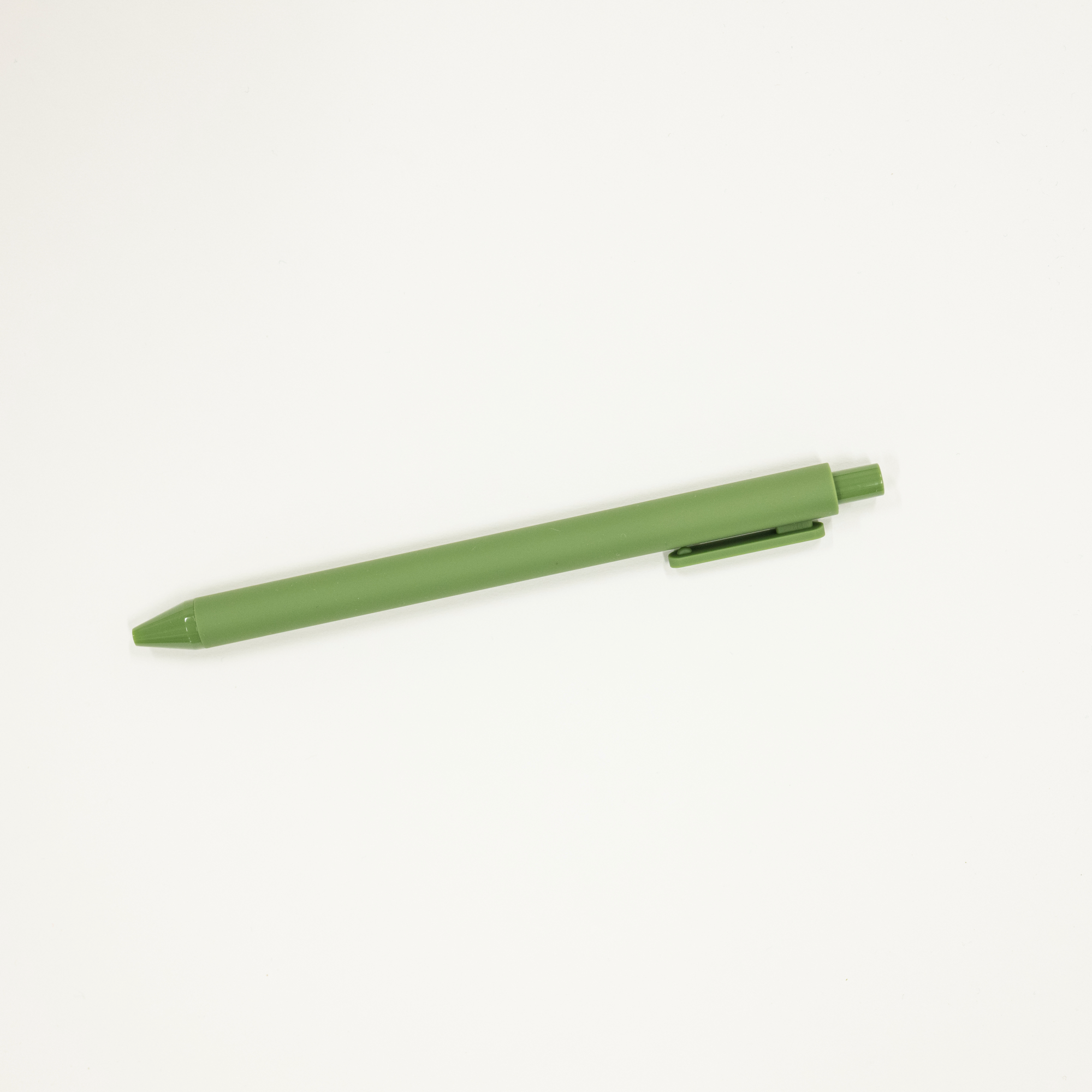 Green pen on a white background