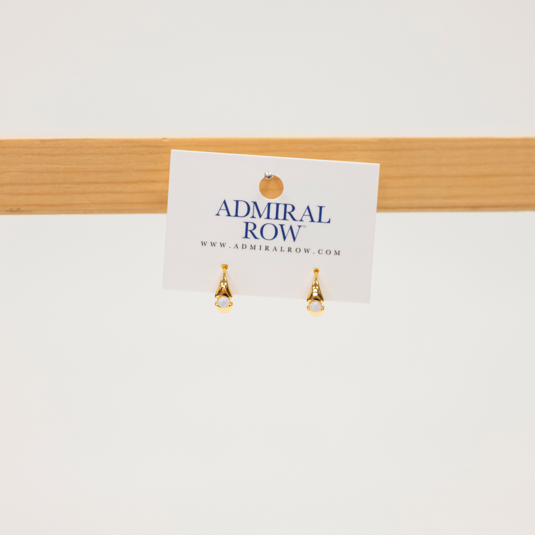 Opal stone set in gold huggies