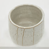 Ceramic cup with a unique design on a white background