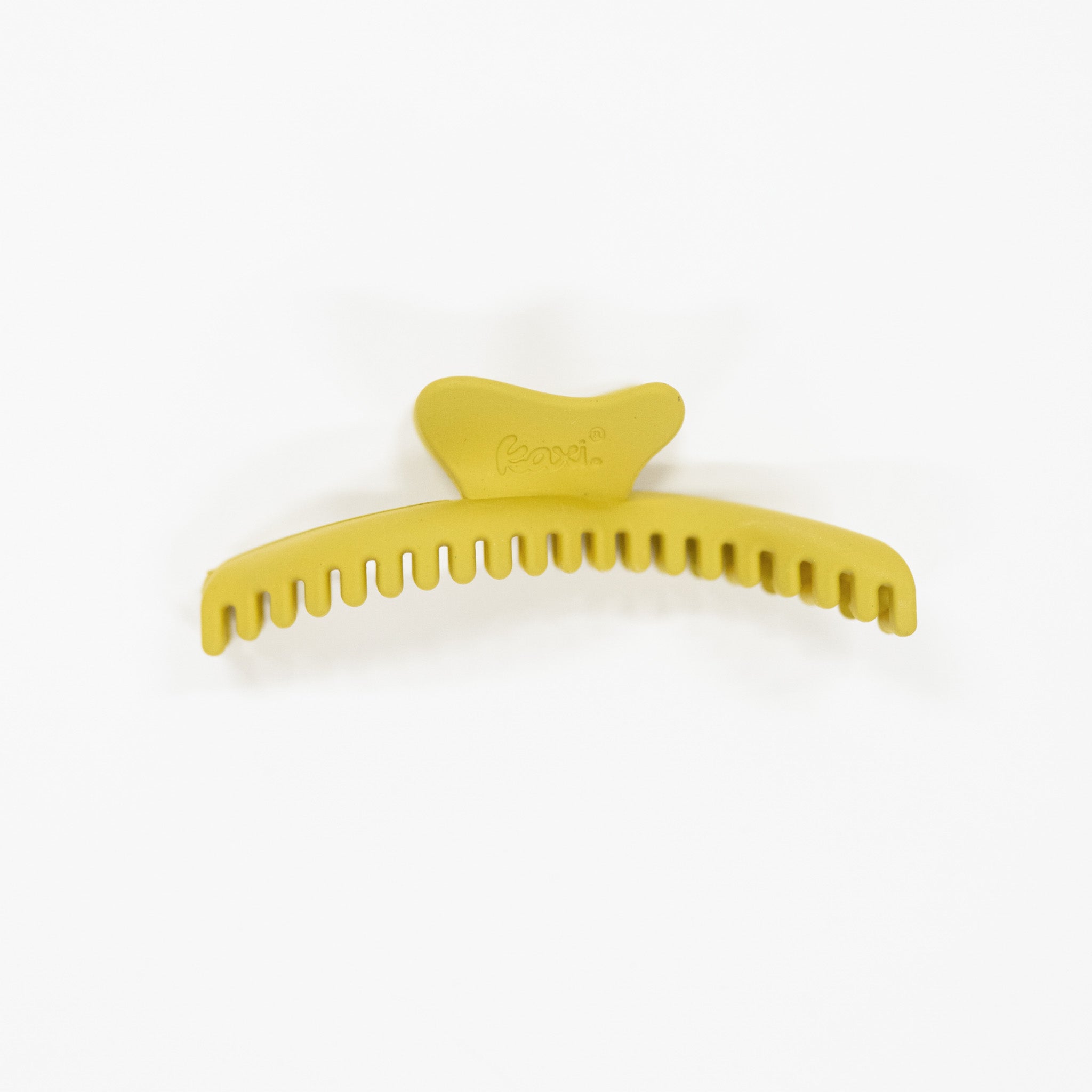 Yellow green hair comb on a white background