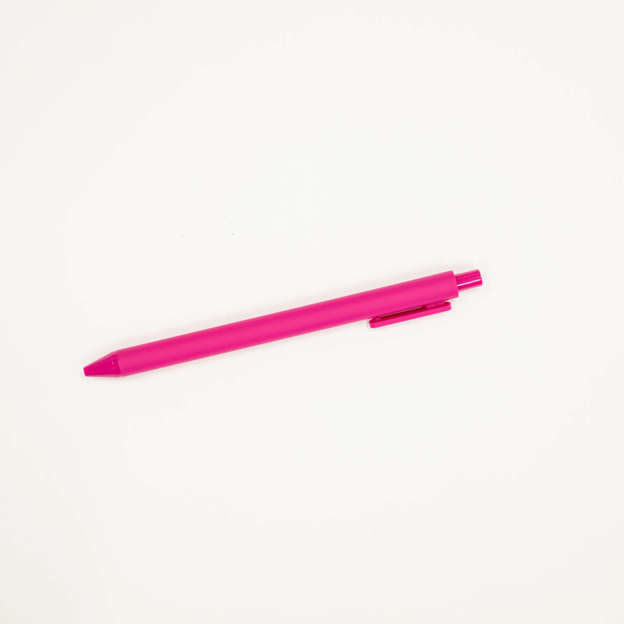 Pink pen on a white background