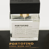 Perfume bottle labeled 'Portofino' by Ampersand Fragrances on a black background
