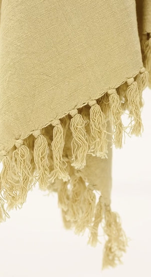 ochre yellow cotton throw blanket with tassels