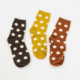 raised polka dots on socks. in colors for fall, brown, mustard and rust