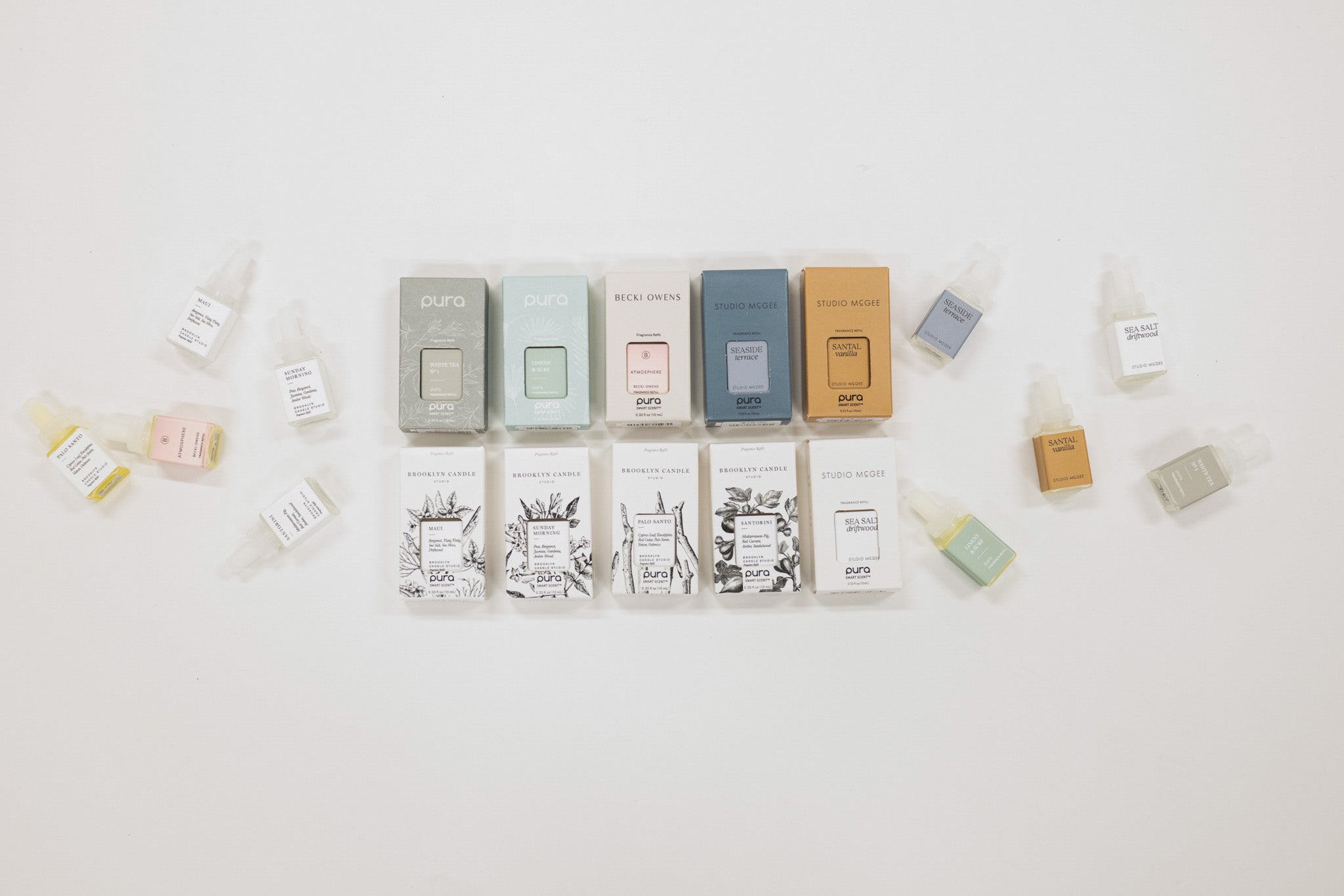 Various small boxes and bottles arranged on a light background