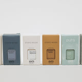 Row of pura boxes with different brands on a white background