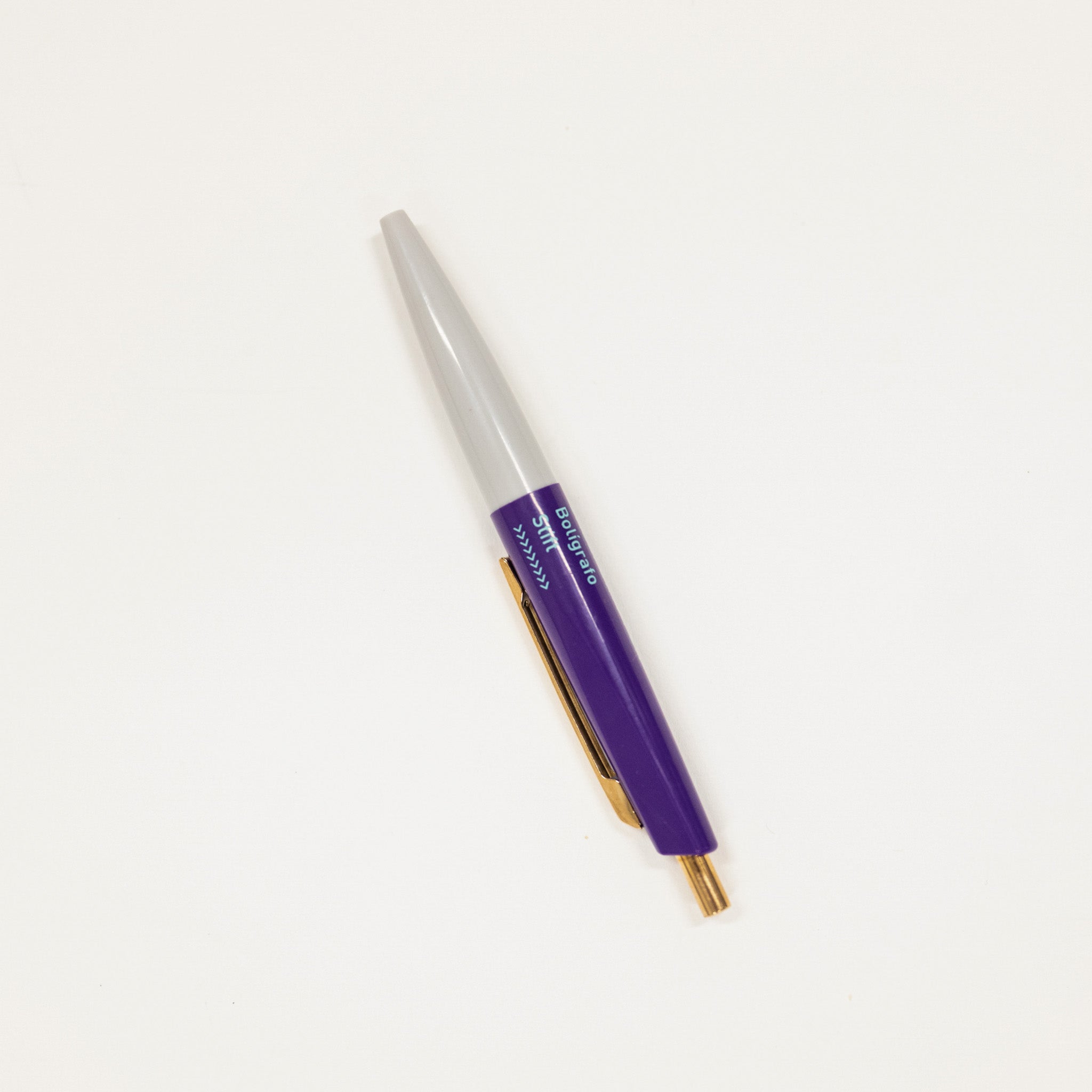 Pen with purple and gold accents on a white background