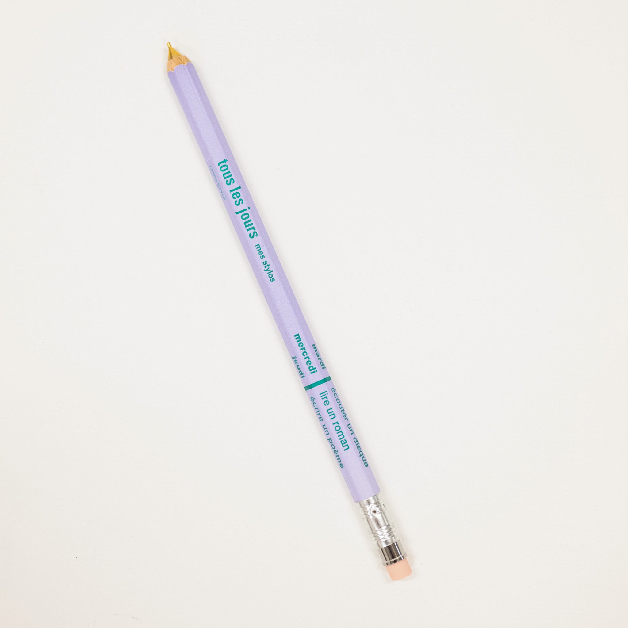 Lavender pencil with gold cap on a light gray background