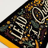 Decorative towel with floral patterns and text on a white background