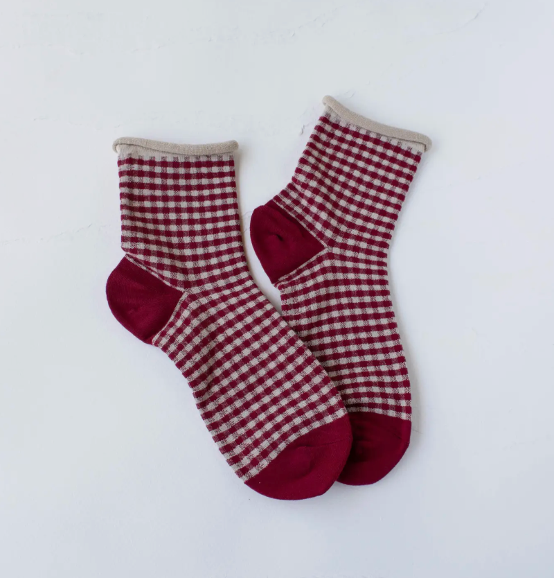 red and oatmeal colored checks with a rolled top, pair of socks