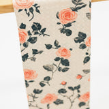 Floral patterned fabric hanging on a wooden rod