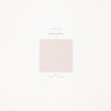Light pink sticky notes on a white background