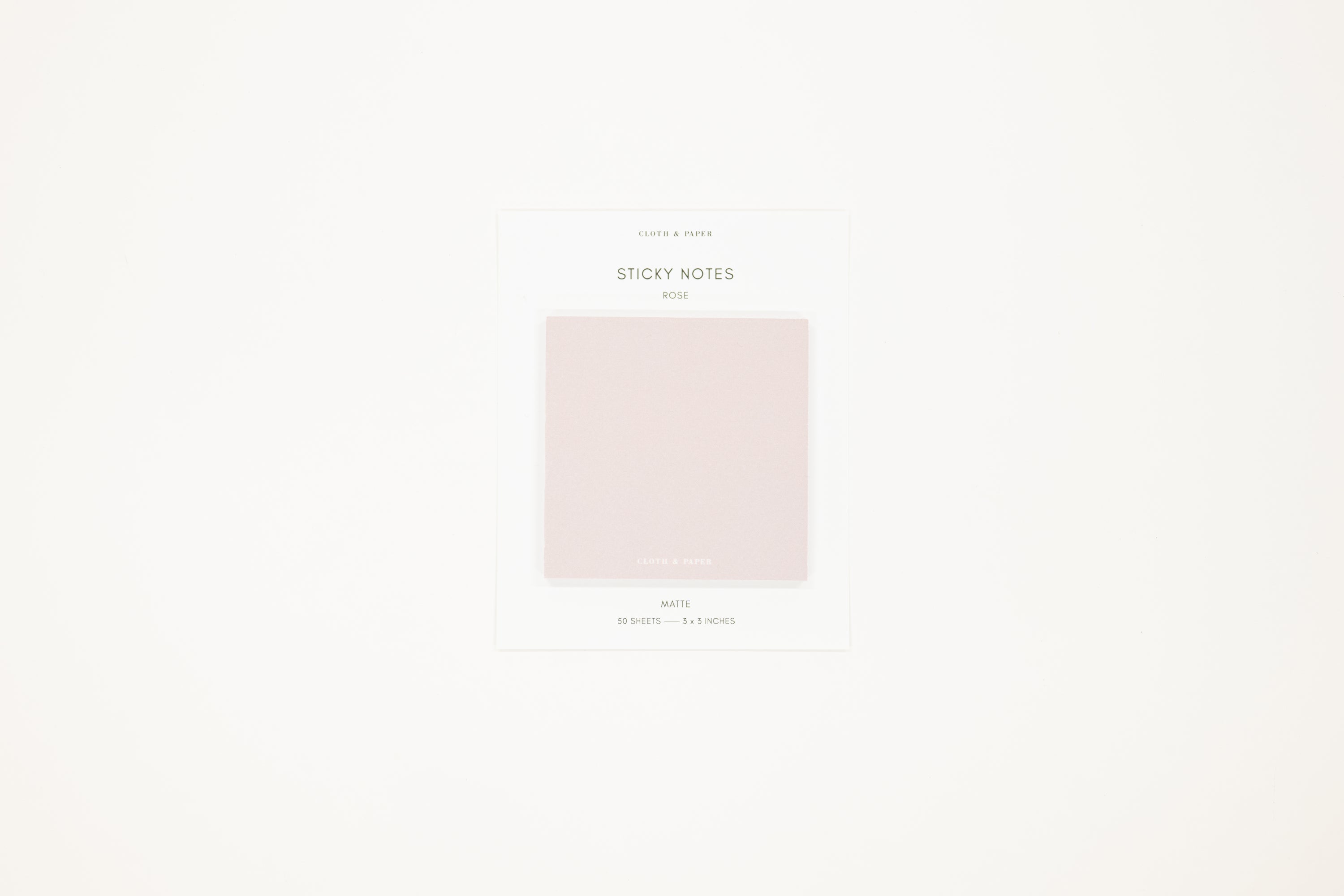 Light pink sticky notes on a white background