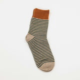 taupe colored socks with green stripes and rust colored top of the crew sock
