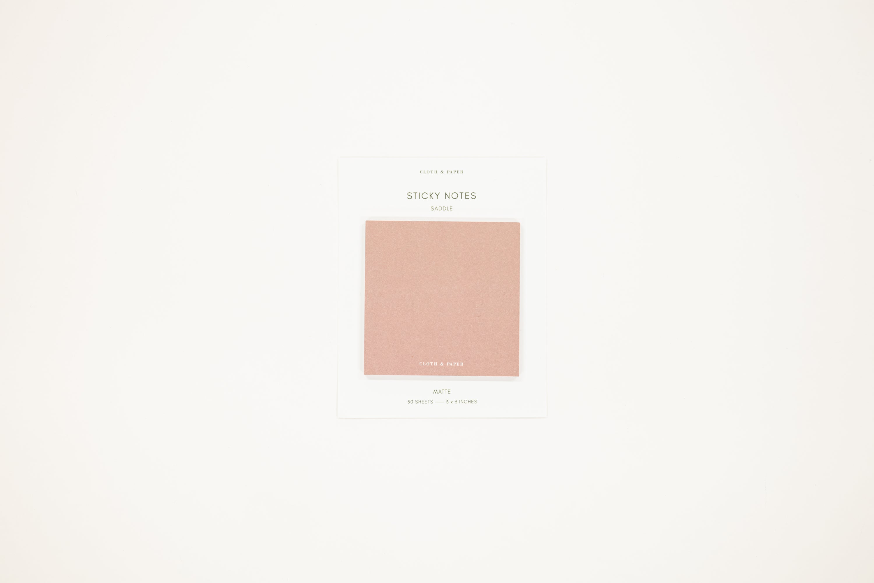 Minimalist design with a pink square color swatch on a light beige background