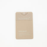 Noshinku Santal Blanc hydrating hand sanitizer in a beige rectangular pump bottle, centered on a plain white background.