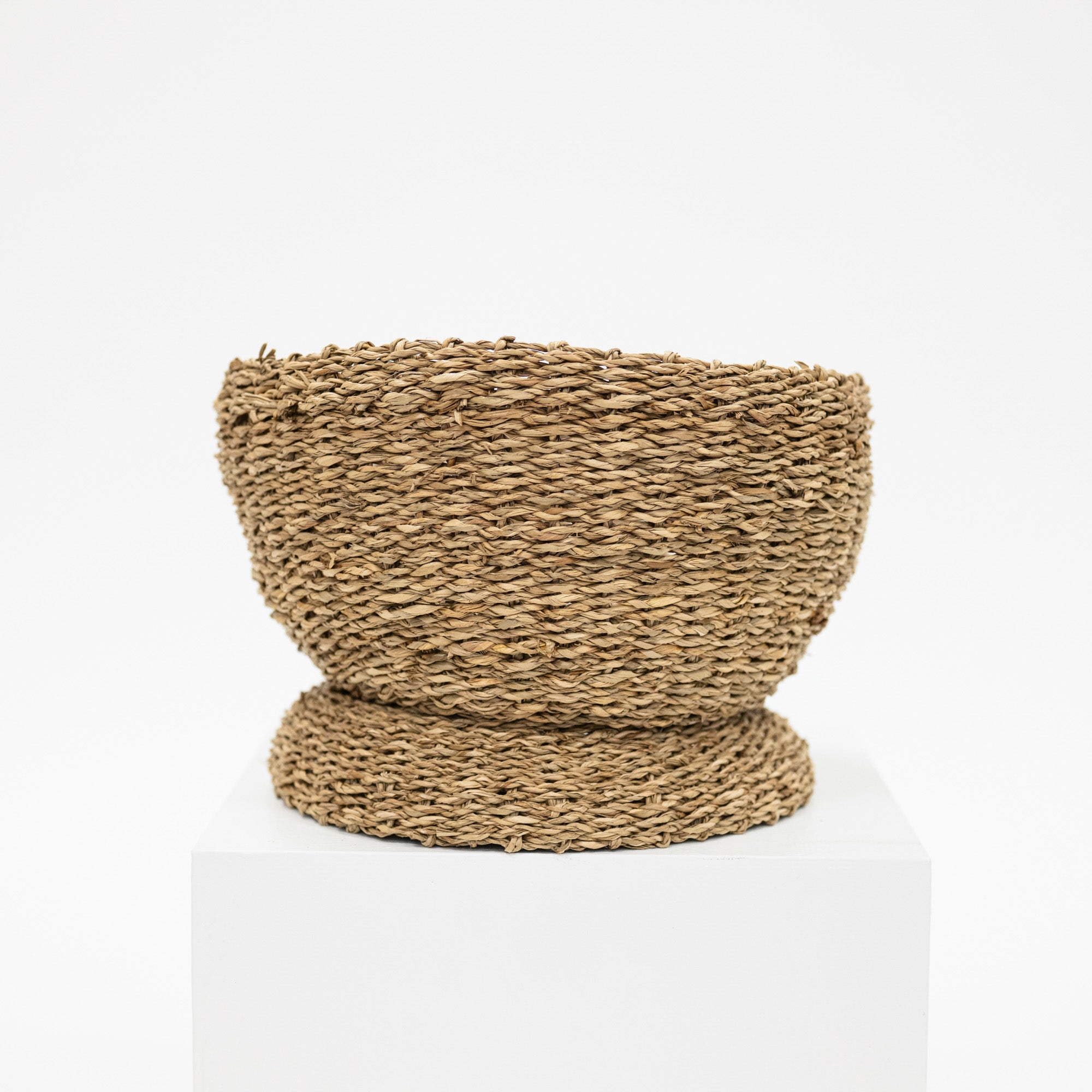 seagrass basket bowl with a raised base.