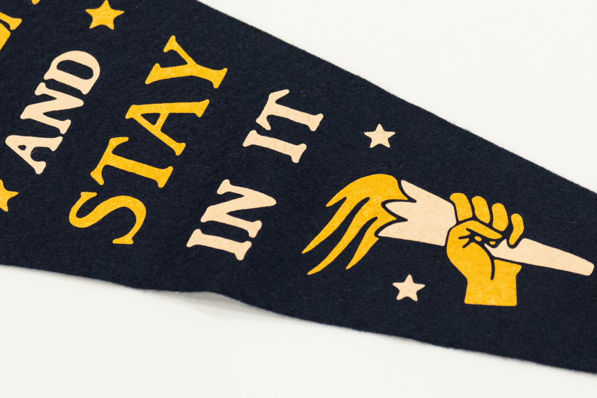 navy wall pennant with phrase "seize the moment and stay in it".