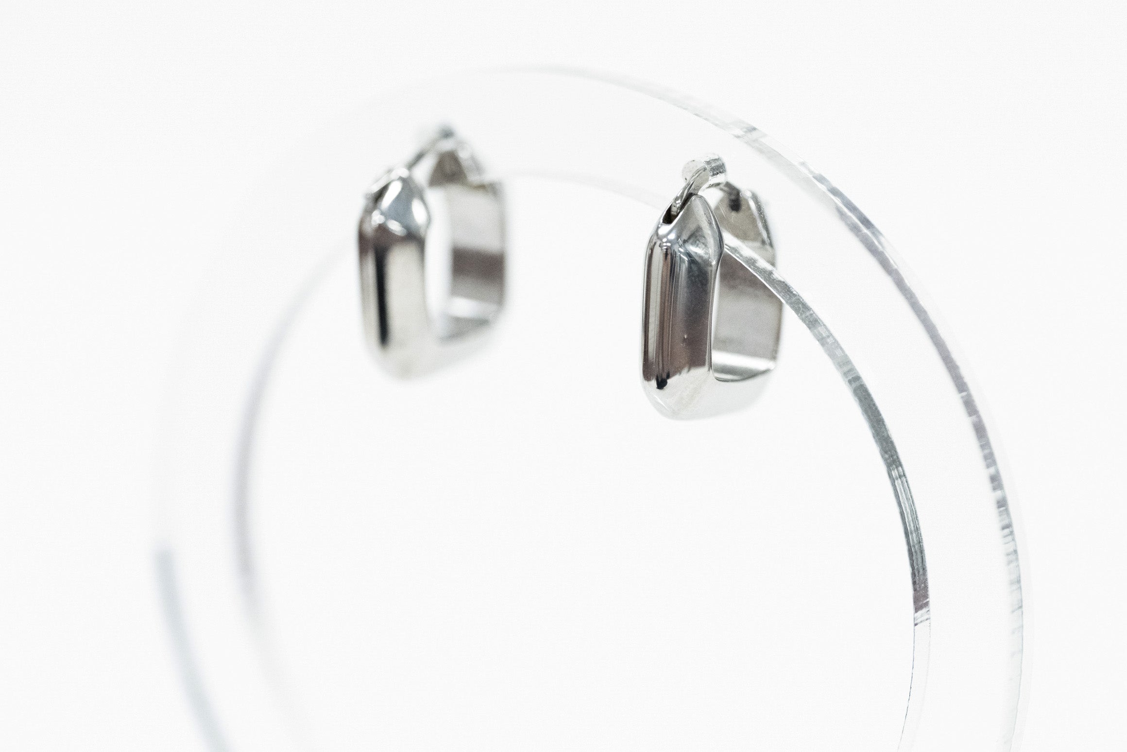 silver square shaped earring huggie side view with white background