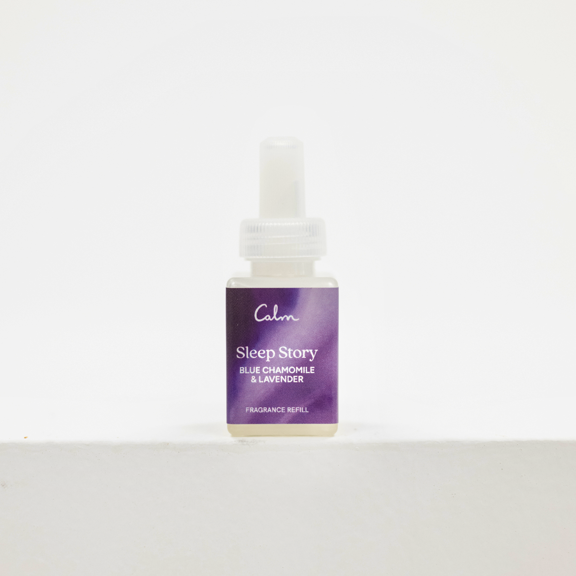 A small bottle of Calm Sleep Story fragrance refill with a purple label and white dropper cap, centered on a white background. Pura fragrance.