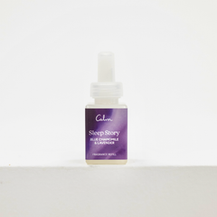 A small bottle of Calm Sleep Story fragrance refill with a purple label and white dropper cap, centered on a white background. Pura fragrance.