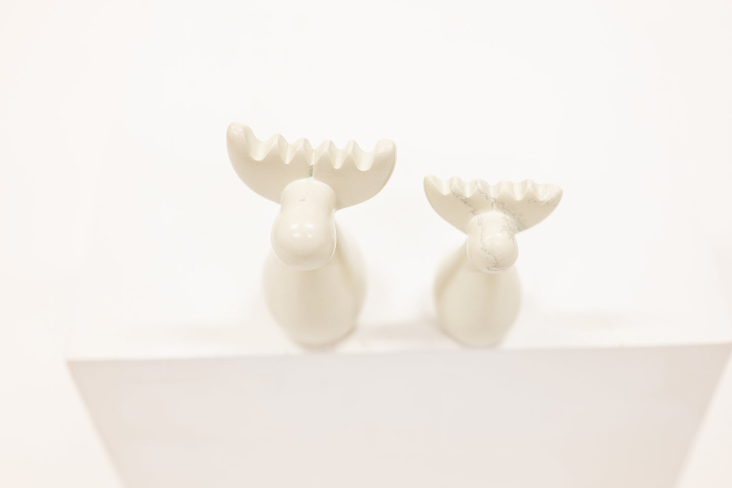 pair of reindeer figurine carved from white soapstone
