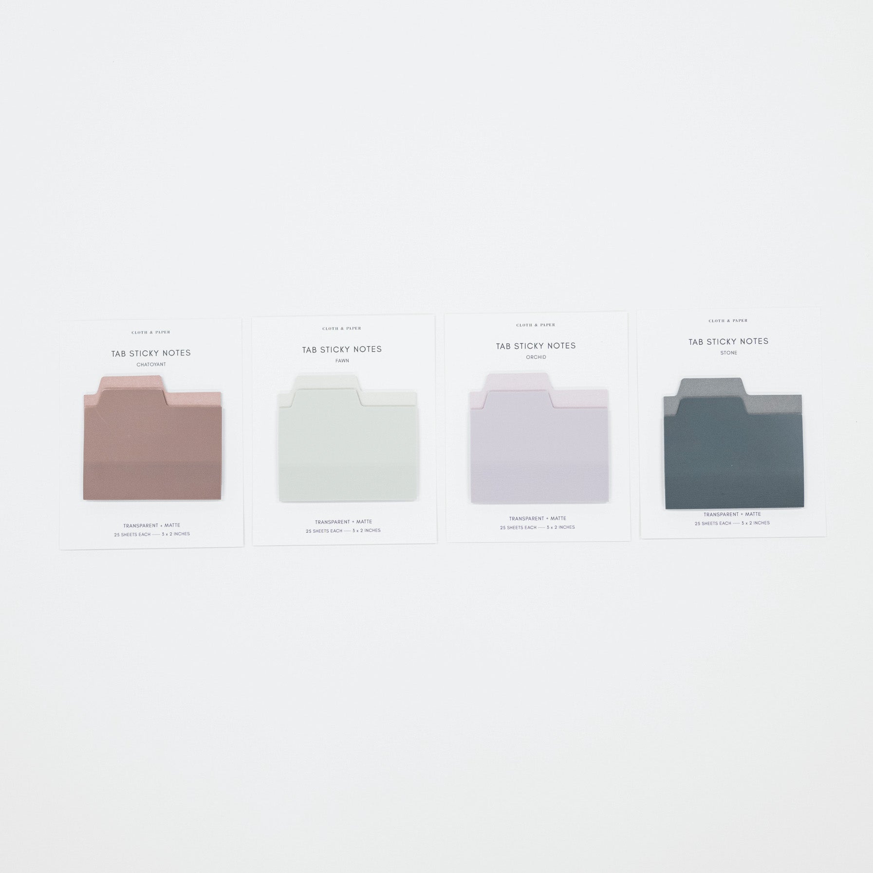 Four minimalist sticky note cards in muted dusty rose, pale sage green, light lavender, and dark slate blue, arranged in a row on a clean white background.