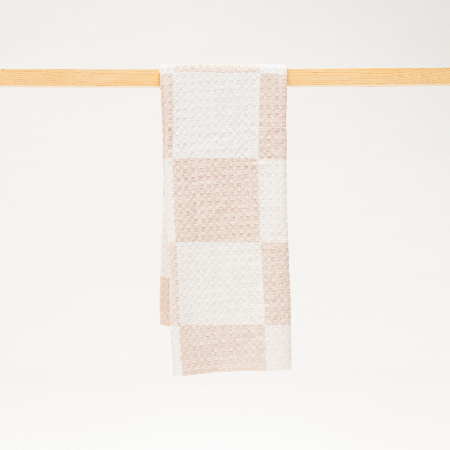 Tan and white checkerboard microfiber kitchen towel