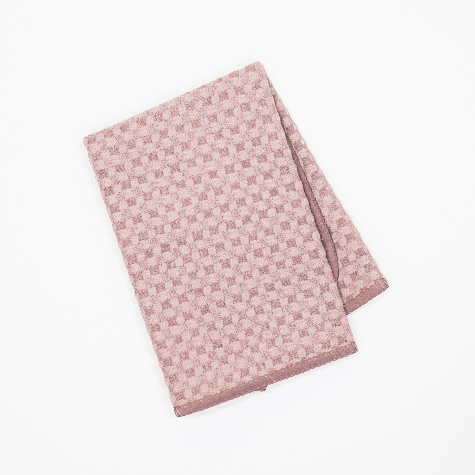 A folded taupe brown microfiber dishcloth featuring a textured basketweave pattern, shown on a clean white background.