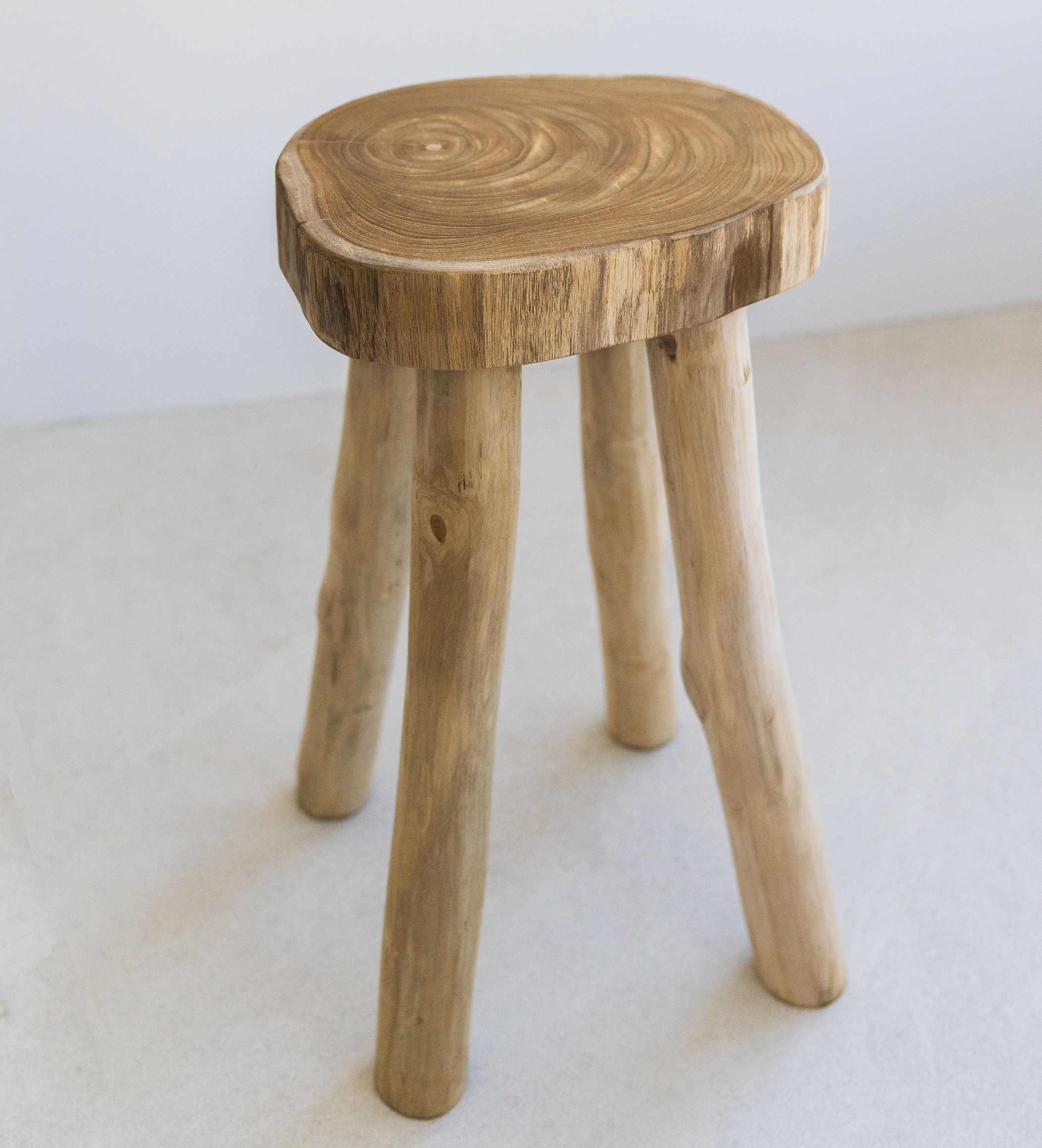 solid teak wood stool with four legs and live edge top