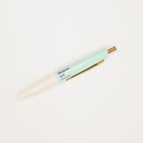 Light blue pen with gold accents on a white background