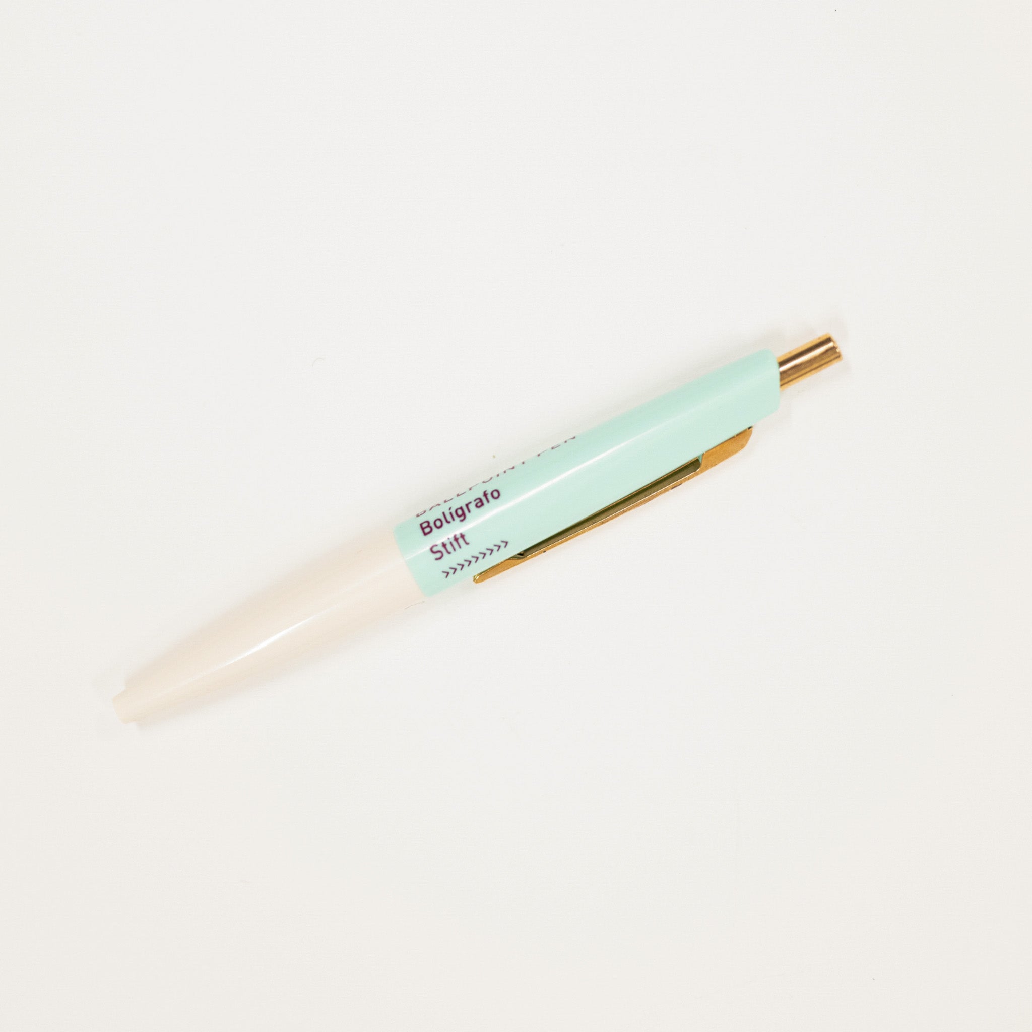 Light blue pen with gold accents on a white background