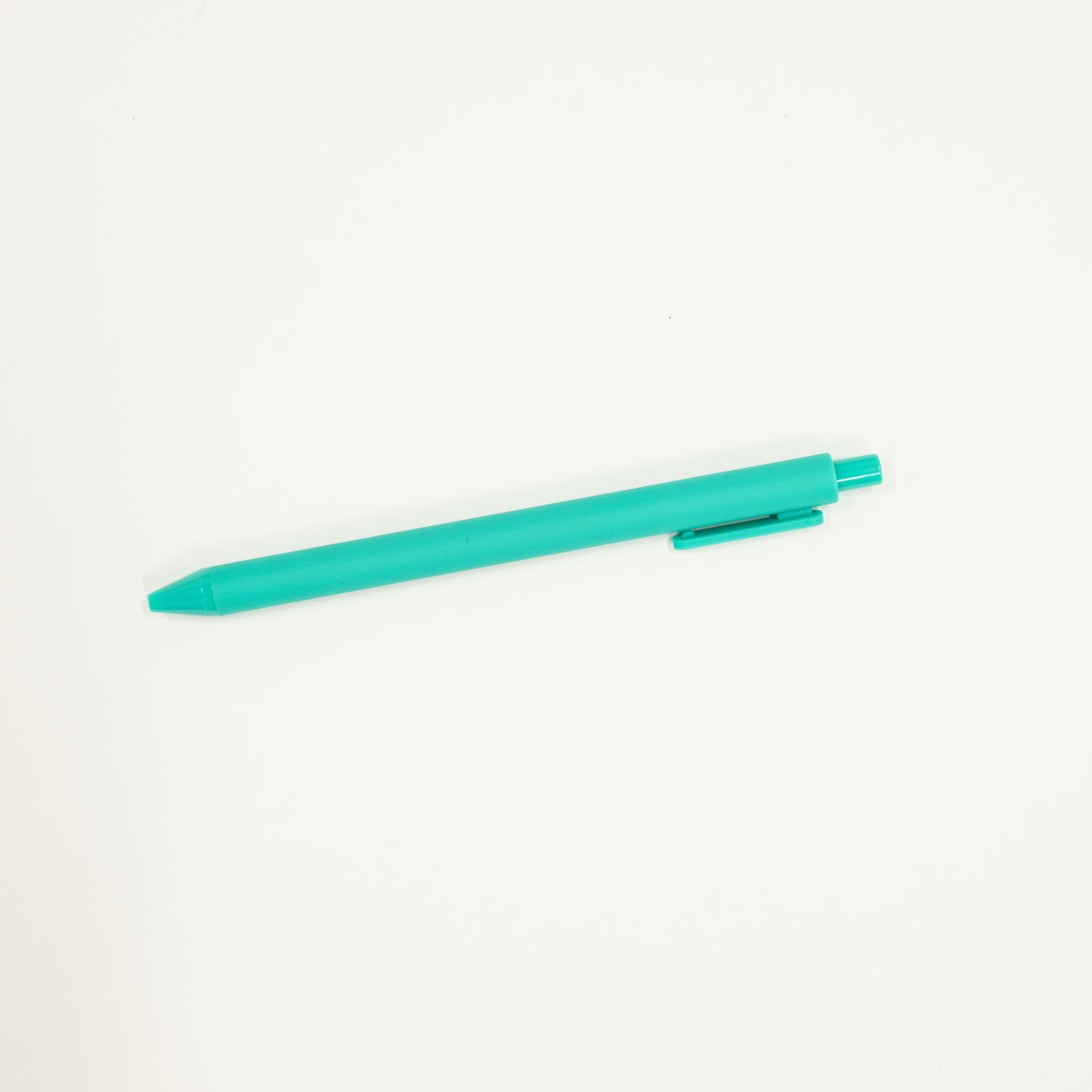 Turquoise pen on a white background