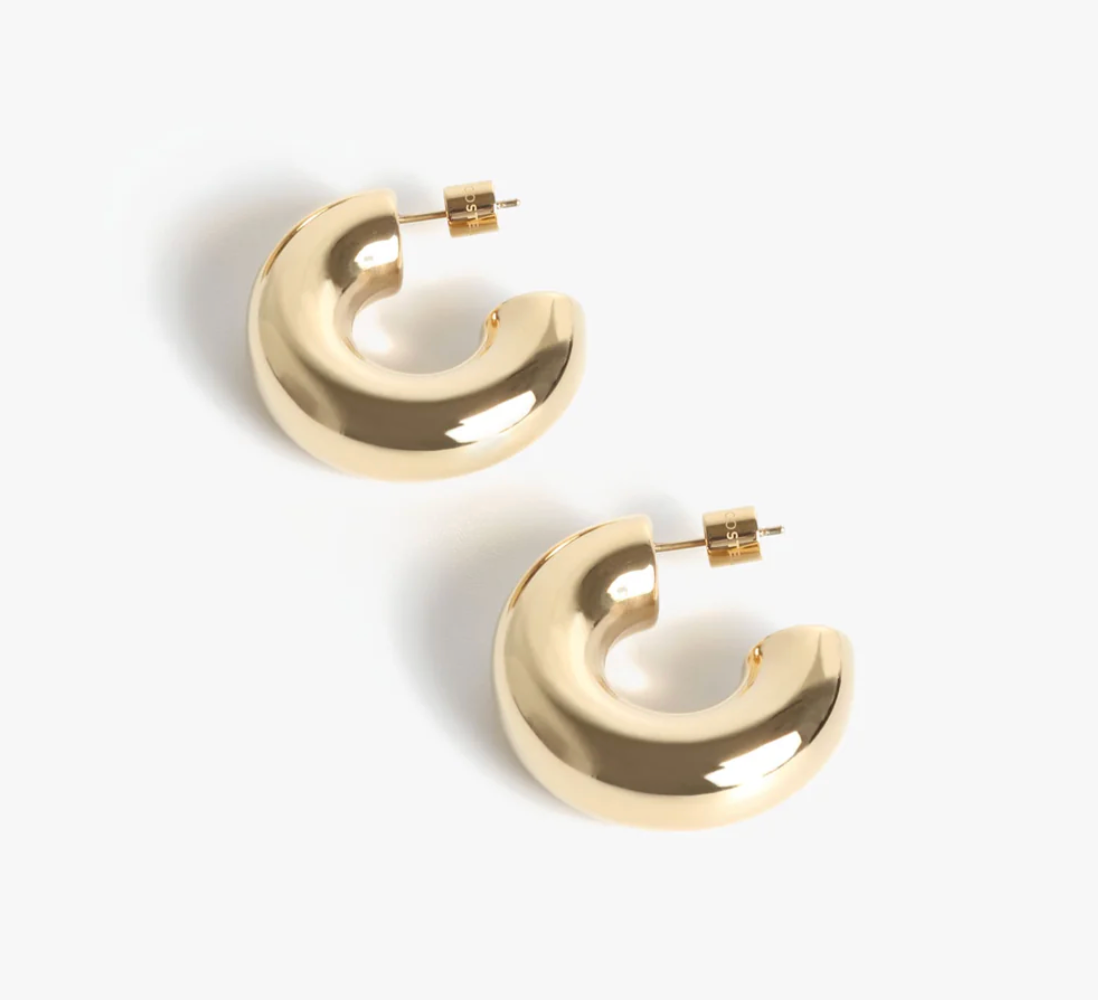 Gold hoop earrings on a white background