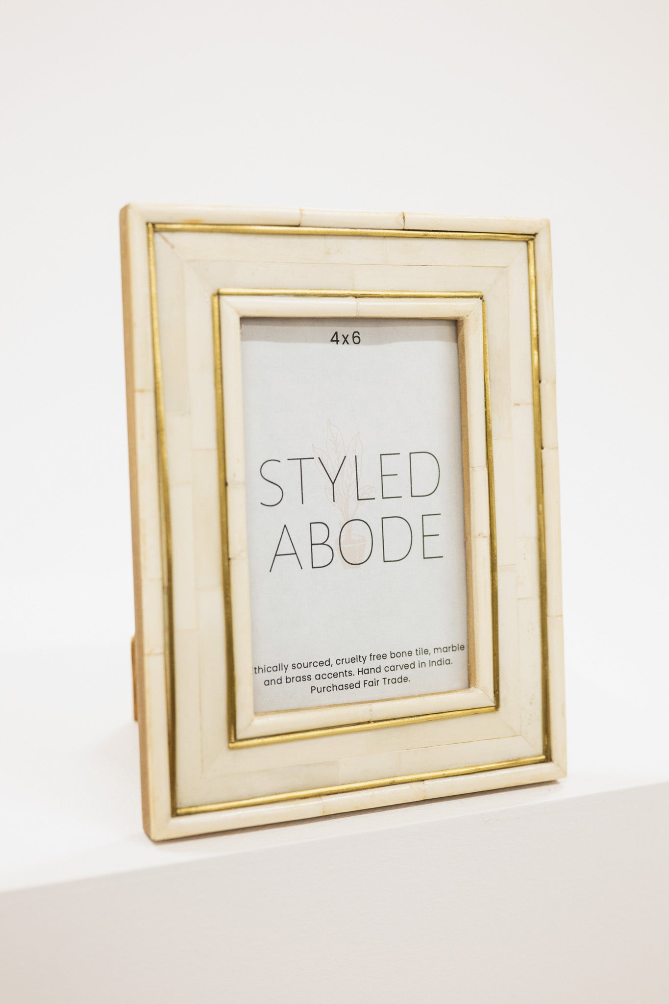 Cream picture frame with 'Styled Abode' label on a white background