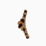 A single scalloped earring with a layered, wavy design in shades of brown and beige, shown against a plain white background.