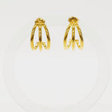Pair of gold hoop earrings on a white background