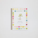 Workbook with palm tree design and colorful square pattern on a white background