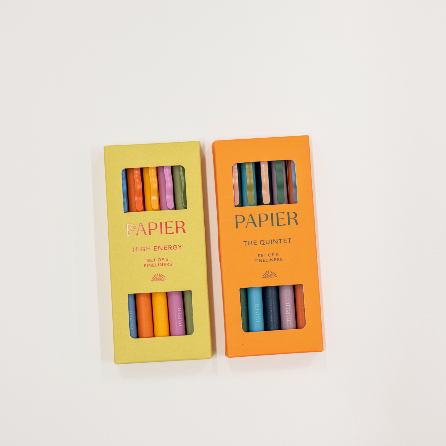 Two boxes of Papier colorful pencils on a white background