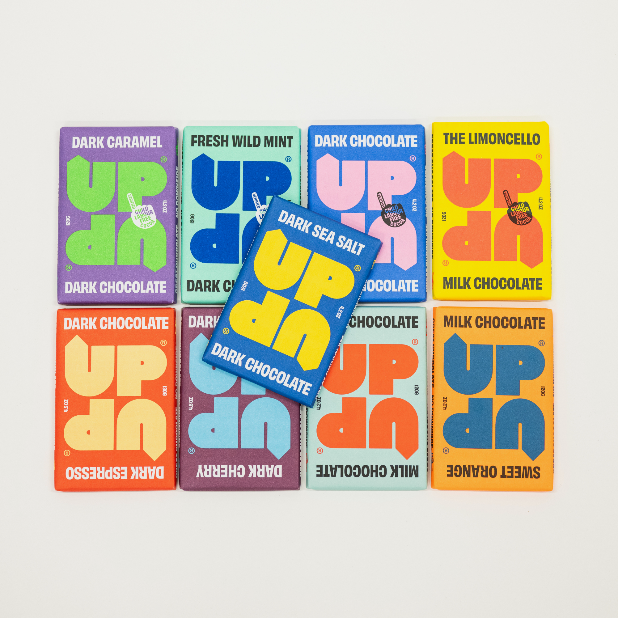 Assorted chocolate bars with colorful packaging on a white background