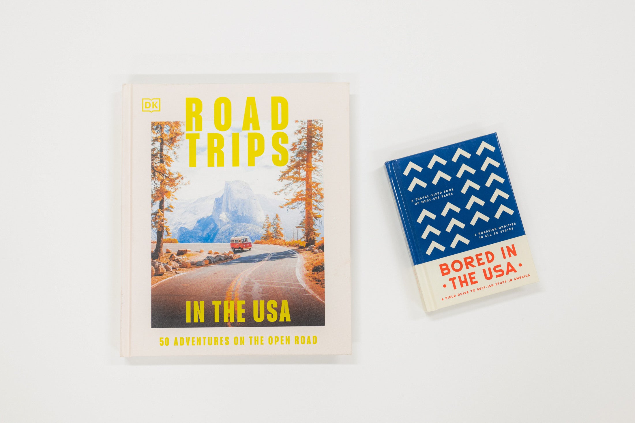 Two books on a white background, one titled 'Road Trips in the USA' and the other 'Bored in the USA'.