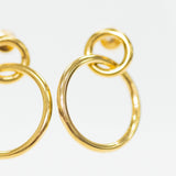 Gold hoop earrings on a white background