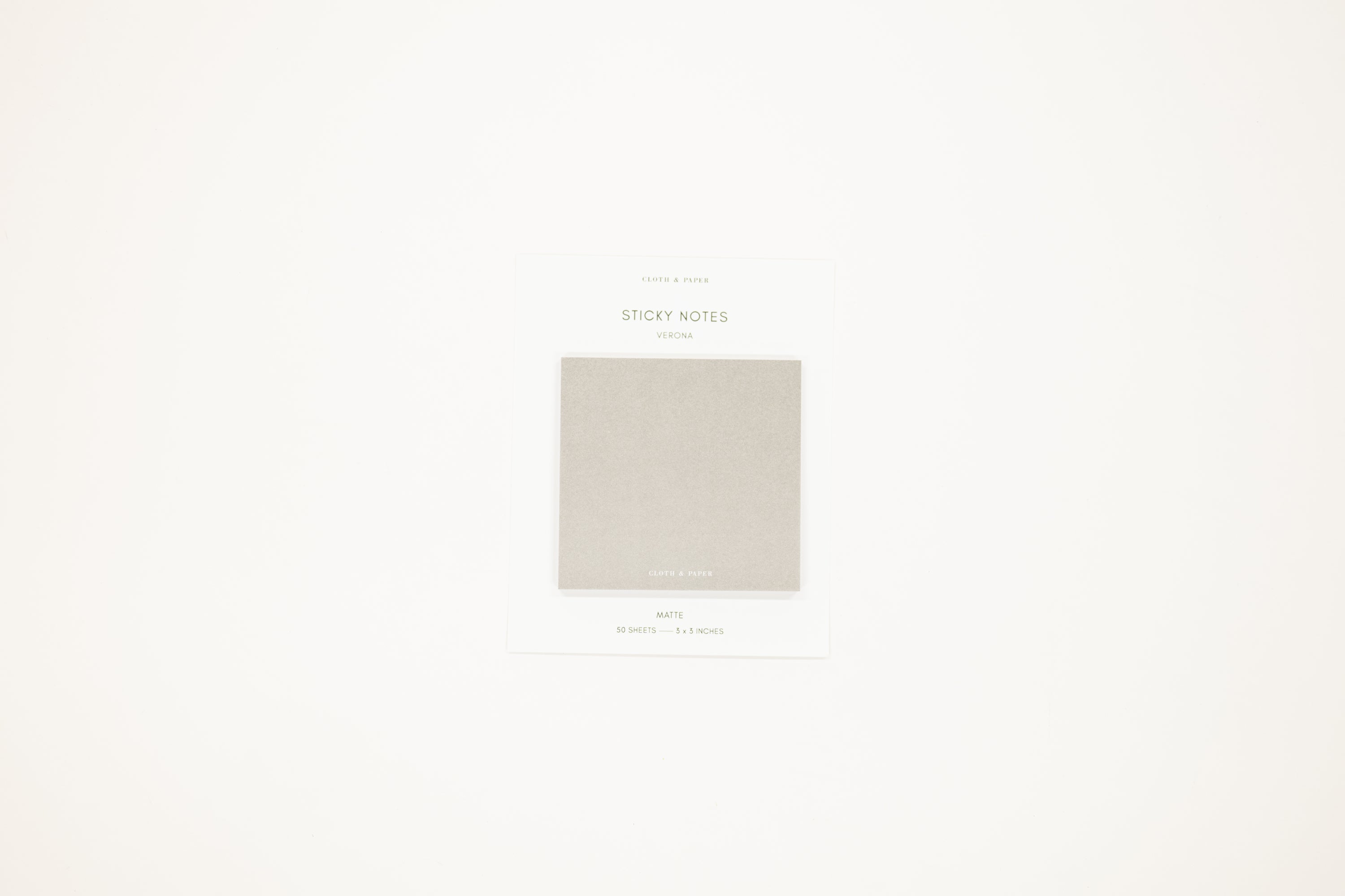 Packaging of sticky notes with a light gray color swatch on a white background