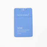 Noshinku Vetiver hand sanitizer in a light blue rectangular bottle with white text, centered on a plain white background.