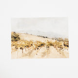 A watercolor landscape painting of a vineyard with rolling hills, grapevines, and distant mountains, presented on a clean white background.