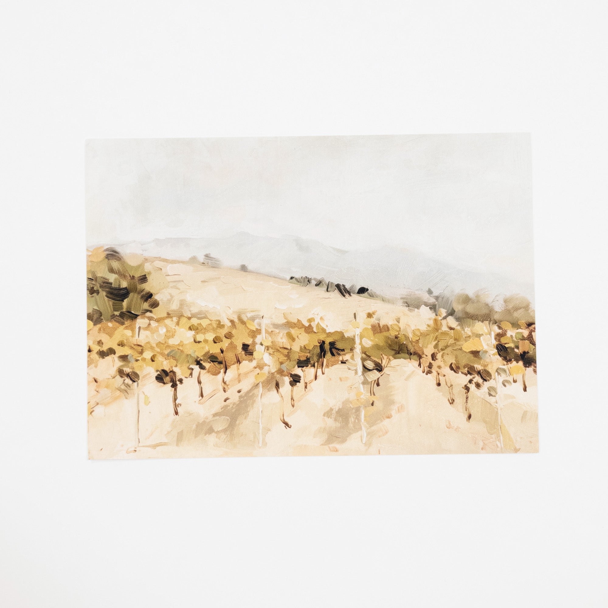 A watercolor landscape painting of a vineyard with rolling hills, grapevines, and distant mountains, presented on a clean white background.