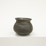 Black ceramic pot on a white background