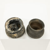 Two ancient clay pots on a white background