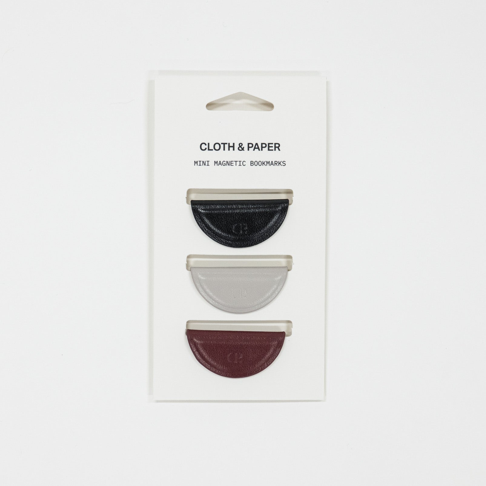 Three mini magnetic bookmarks on a 'Cloth & Paper' branded card against a white background