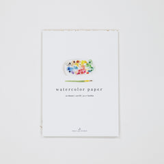 Watercolor paper packaging with a colorful paint palette illustration on a white background